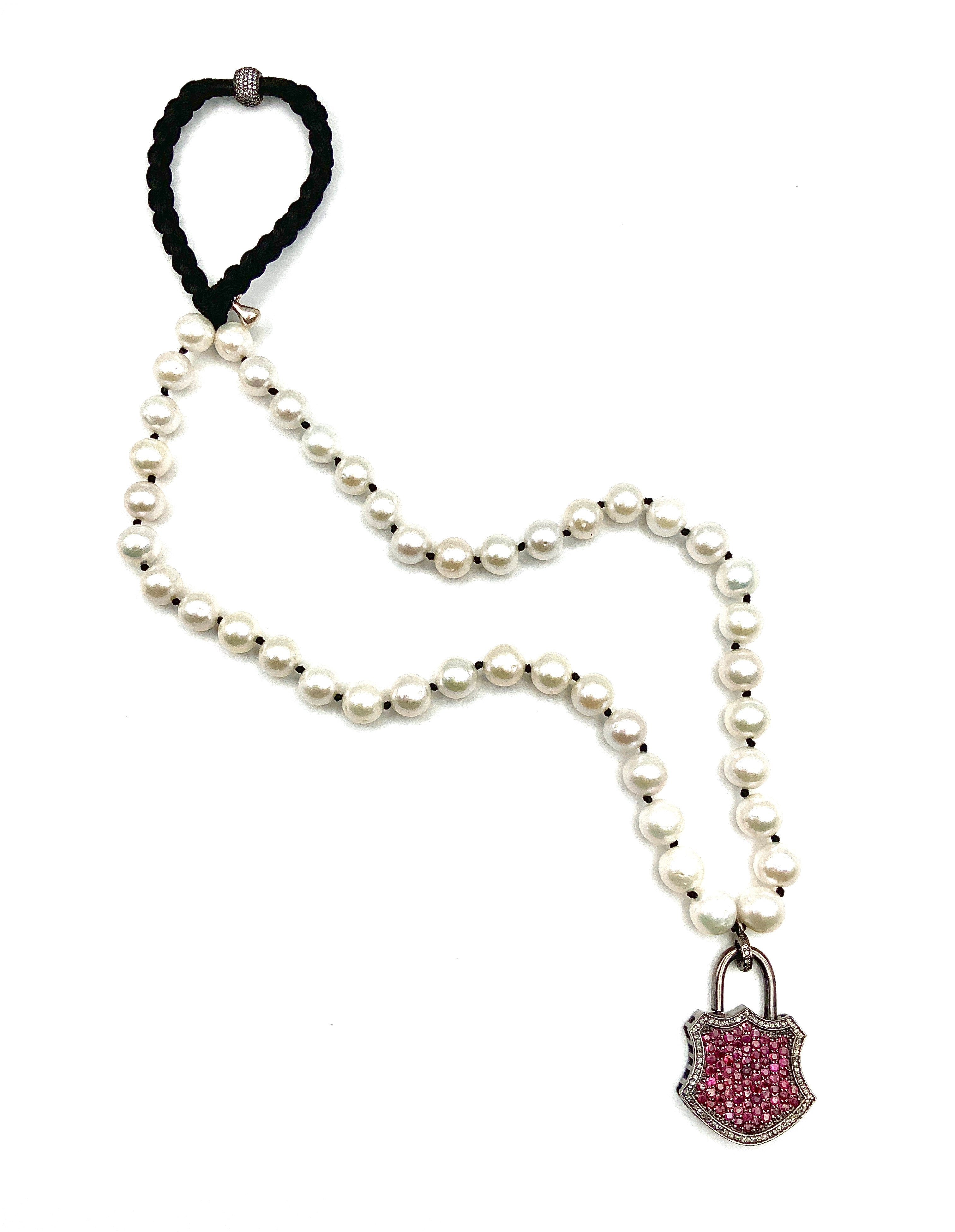 # 20 White Pearls & Sterling Silver Rubi Inlaid Lock Pendant