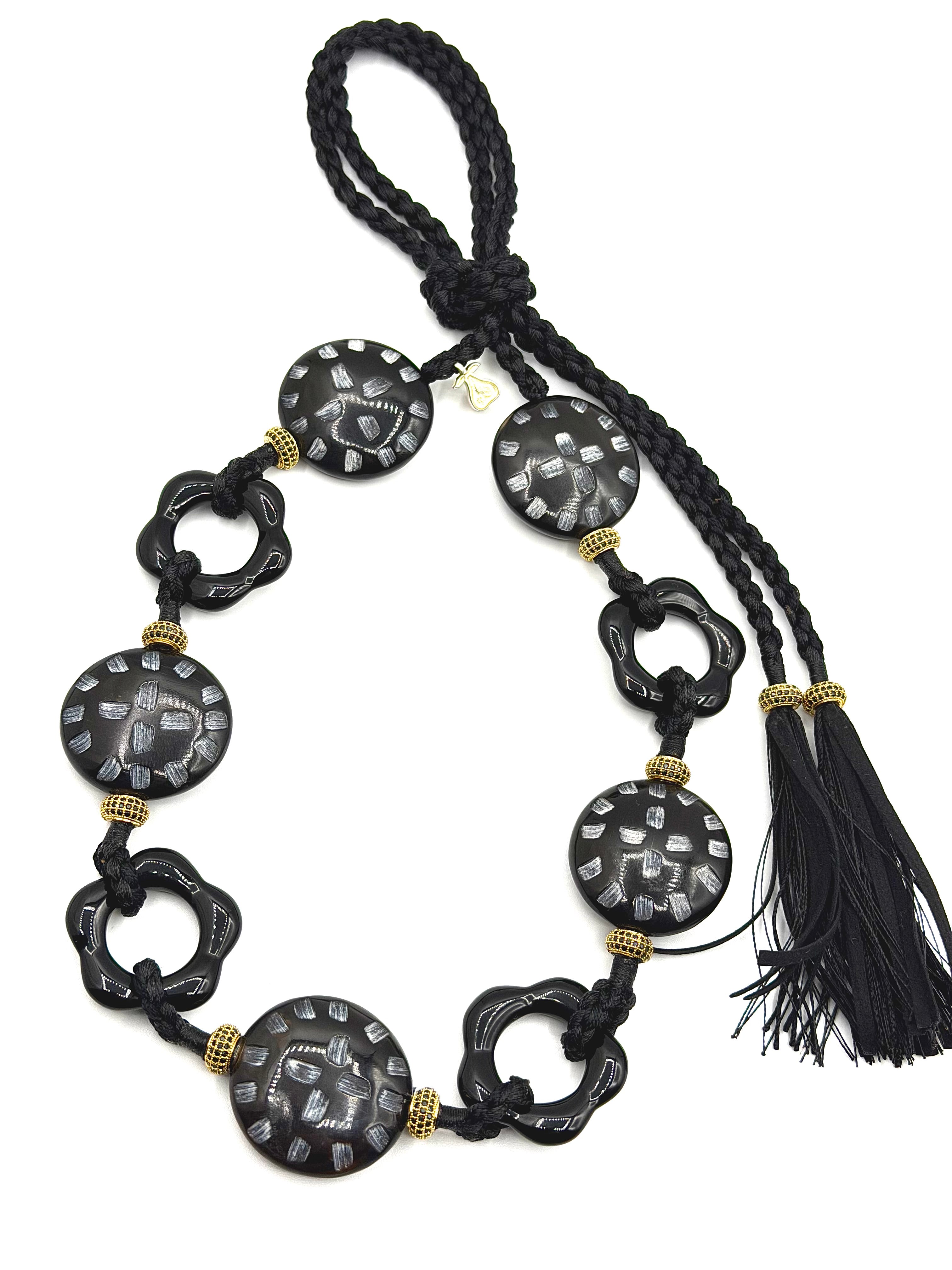 # 1 Onyx Flowers & Carved Horn Details - Handcrafted with striking onyx blooms & intricately carved horn beads